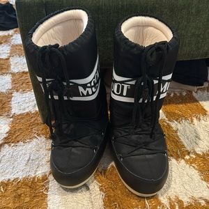 Lightly worn black knee high moon boots